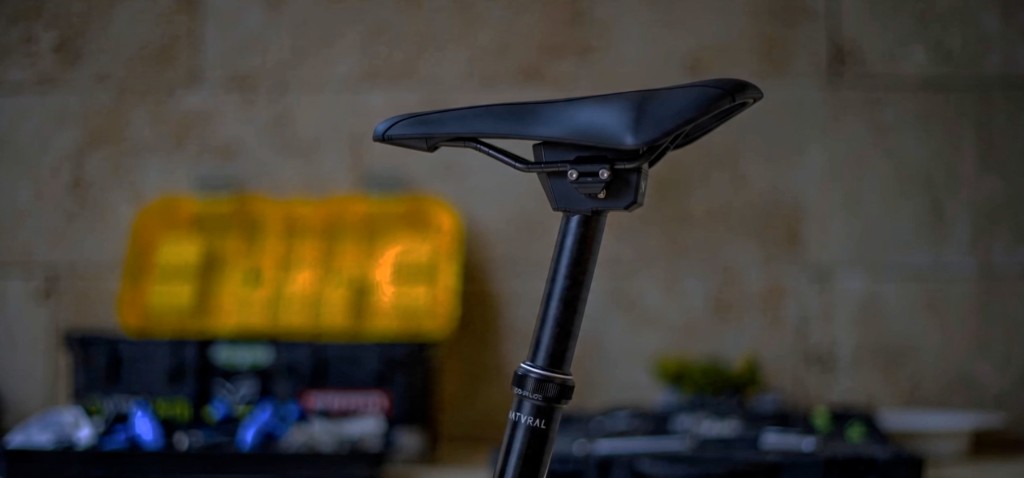 NATVRAL Co-Pilot dropper post and saddle close-up in workshop
